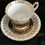 Black with heavy gold trim tea cup and saucer