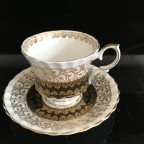 Black with heavy gold trim tea cup and saucer