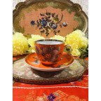 Unique bright red orange tea cup and saucer