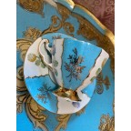 Bone china blue tea cup and saucer with thistles