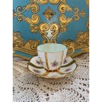 Gold striped floral tea cup and saucer