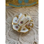 Gold striped floral tea cup and saucer