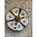 Gold striped floral tea cup and saucer